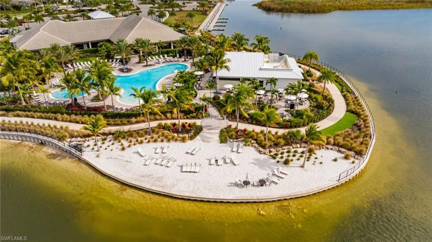 Aerial view of a nearby body of water and a pool area