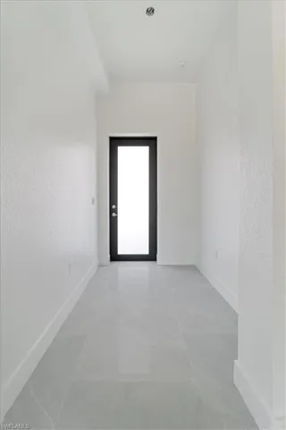 Spare room featuring baseboards