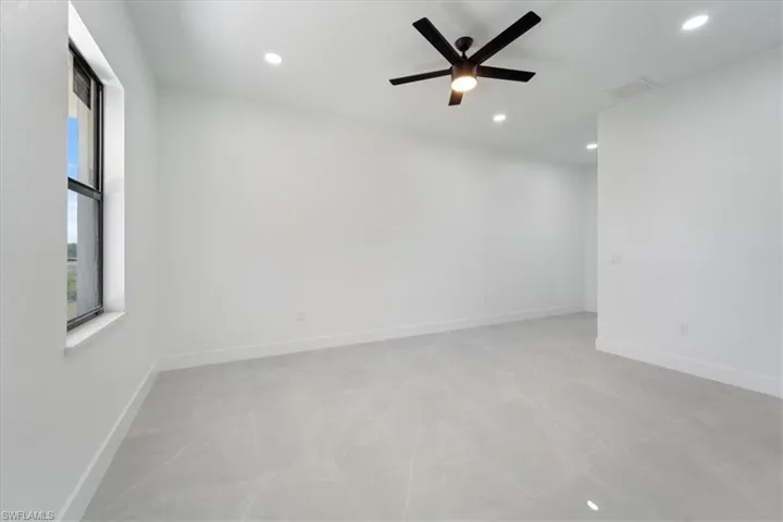 Spare room featuring recessed lighting, a ceiling fan, visible vents, and baseboards