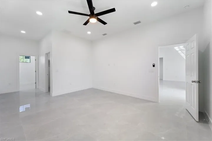 Unfurnished room featuring baseboards, recessed lighting, visible vents, and ceiling fan