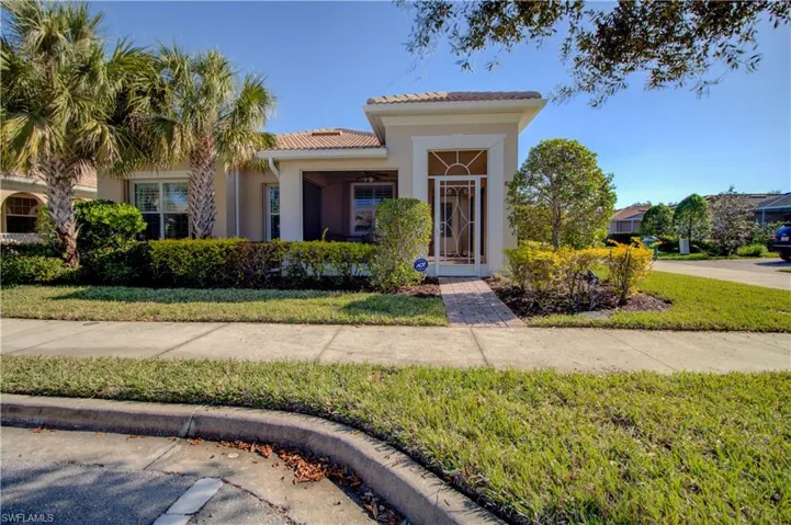 front of home with custom screened front porch and full storm protection