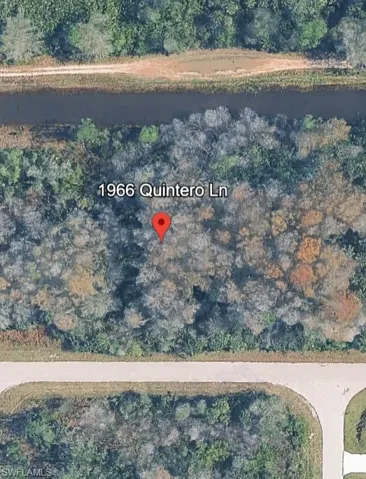 Aerial overview of property's location featuring a nearby body of water