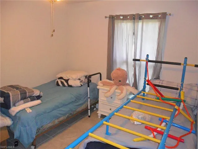 Bedroom featuring tile patterned floors