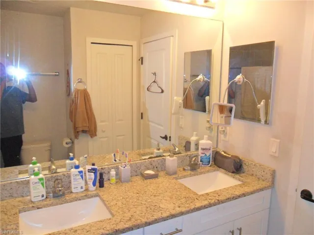 Bathroom featuring double vanity