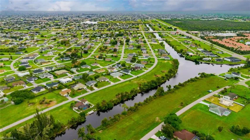 Aerial view of residential area with a nearby body of water