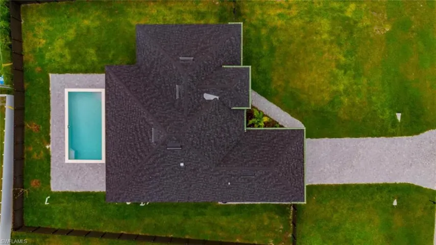 View of subject property featuring a pool area