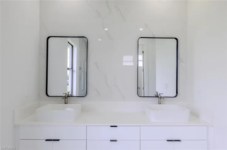 Full bathroom featuring double vanity
