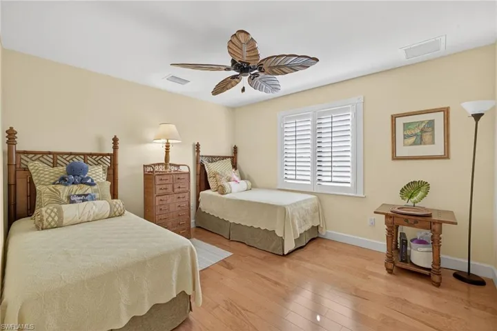 Bedroom featuring light wood-style flooring and a ceiling fan