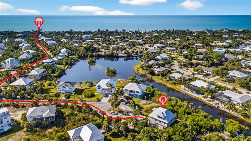 Aerial perspective of suburban area with a large body of water