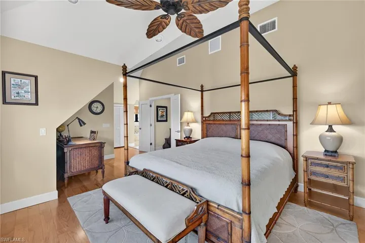 Bedroom with light wood finished floors and ceiling fan
