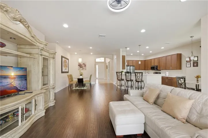 View from the pool entrance, dining, kitchen and view of the front door