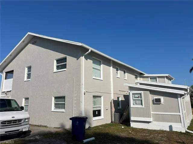 Back of house with stucco siding