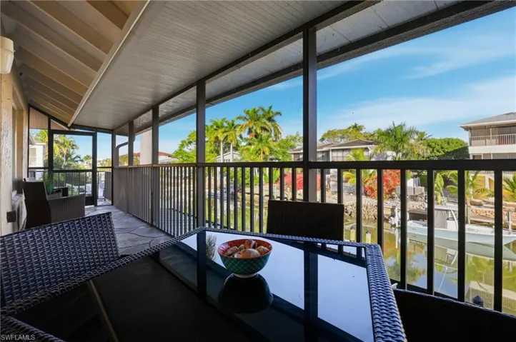 The screened in lanai runs the width of the entire unit allowing for an outdoor sitting area as well and dining with unobstructed water views