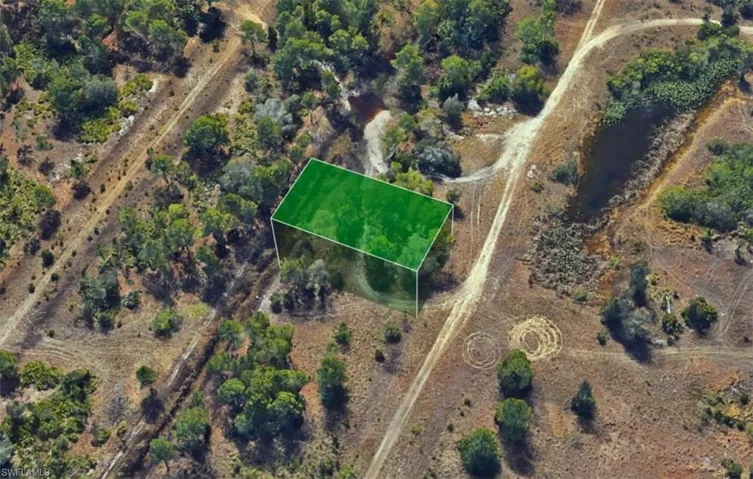 Aerial view of property's location with property boundaries highlighted and rural landscape