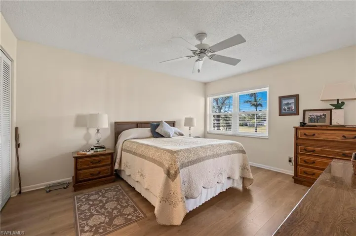 The master bedroom is spacious, provides plenty of light and features two closets.