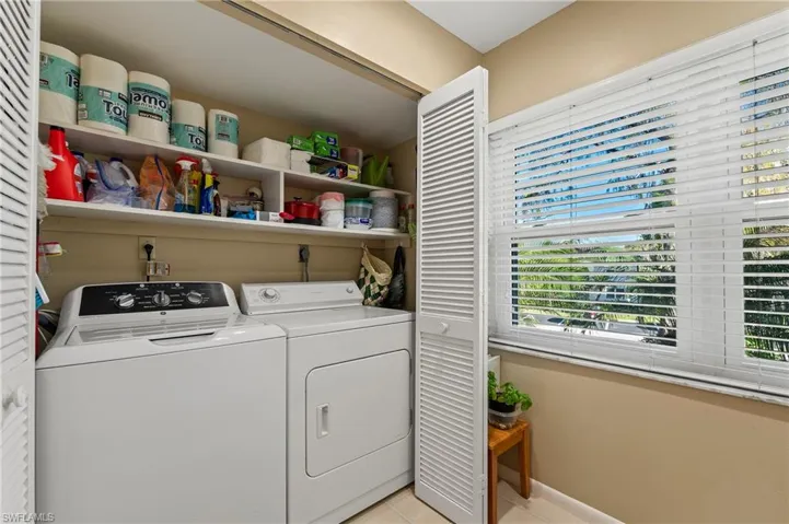 The kitchen has a nice enclosure for the washer and dryer, and additional storage space as well.