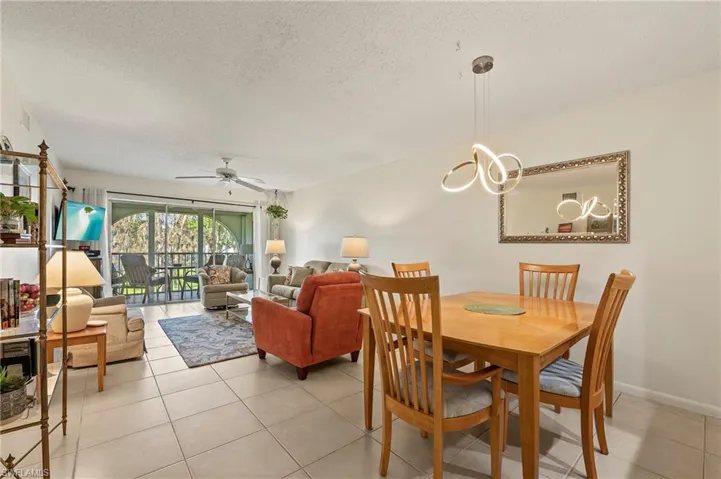 The dining room features two additional chairs for entertaining guests, and is just through the pass through from the kitchen.