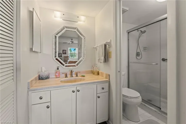 The master bathroom has been updated, too, and features sliding glass doors in the shower area. The commode and shower provide privacy with a separate door.