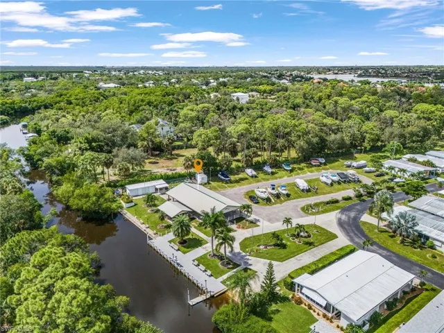 Waterfront community featuring multiple boat slips, boat storage, and direct water access