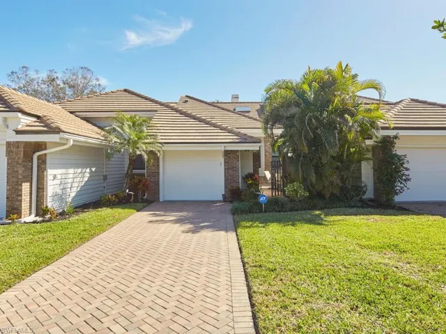 Ranch-style house with a front courtyard, garage  beautiful landscaping w/auto sprinklers