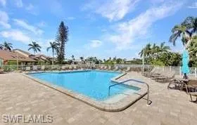 View of swimming pool with a patio BBQ area