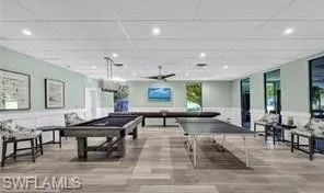 Clubhouse Playroom featuring a paneled ceiling, pool table, and light wood-type flooring