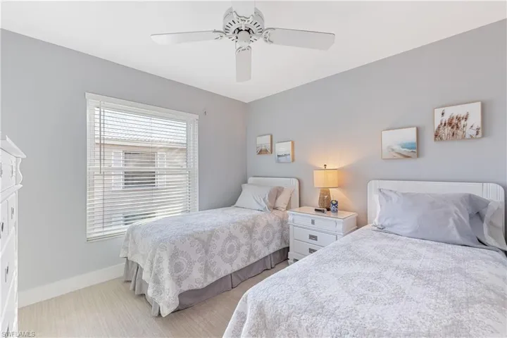 Guest Bedroom with ceiling fan and new carpet
