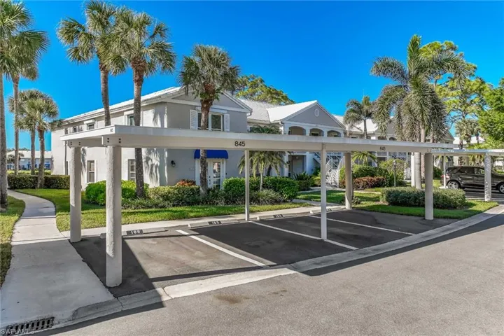 View of car parking area featuring a carport