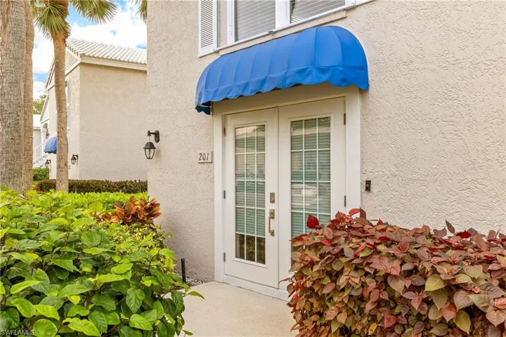 Property entrance featuring french doors