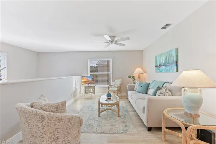 Bonus room area with ceiling fan and light hardwood / wood-style floors