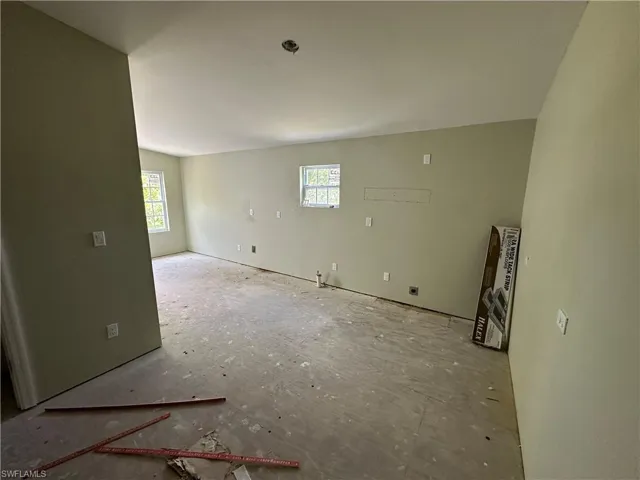 Unfurnished room with plenty of natural light