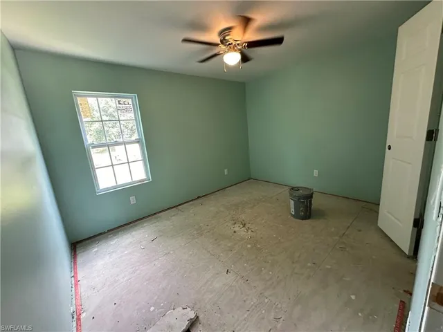 Unfurnished room featuring ceiling fan