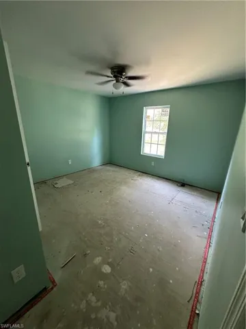 Spare room with ceiling fan