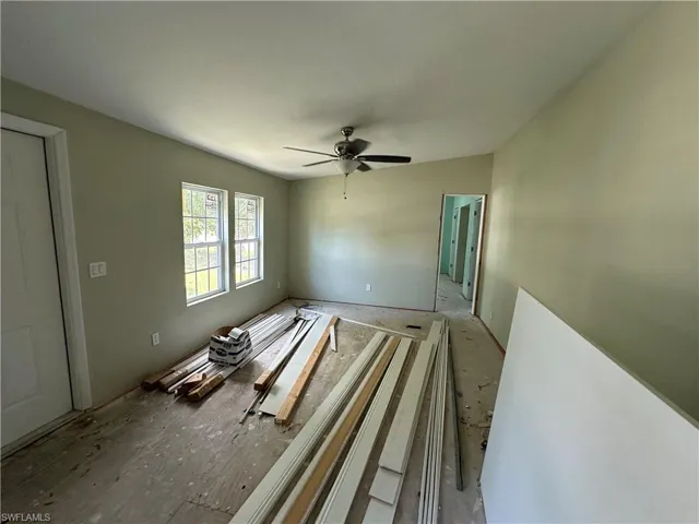 Spare room with ceiling fan