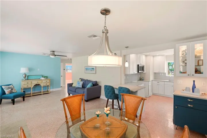 Dining space featuring baseboards and ceiling fan