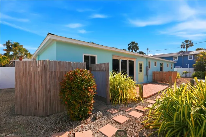 Back of property with stucco siding and a patio area