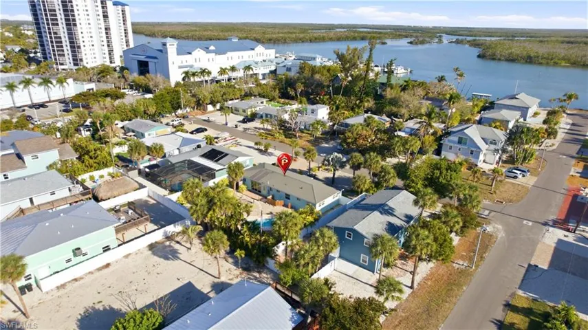 Aerial view of residential area featuring a large body of water