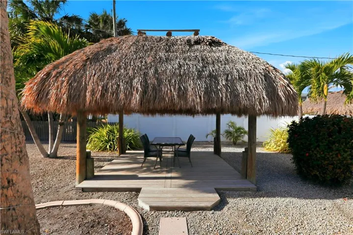 View of community featuring a gazebo and outdoor dining space