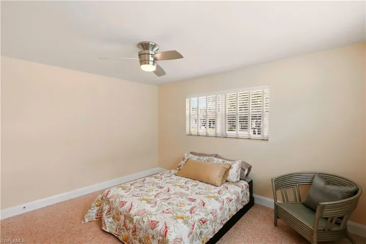 Bedroom featuring carpet floors and ceiling fan