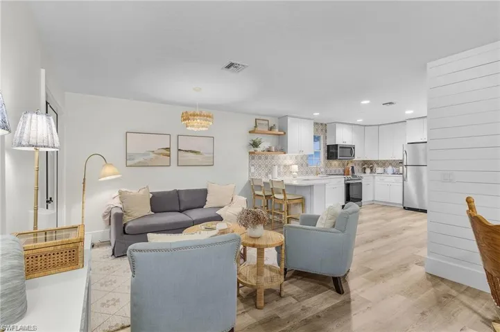 Living room featuring a chandelier and recessed lighting