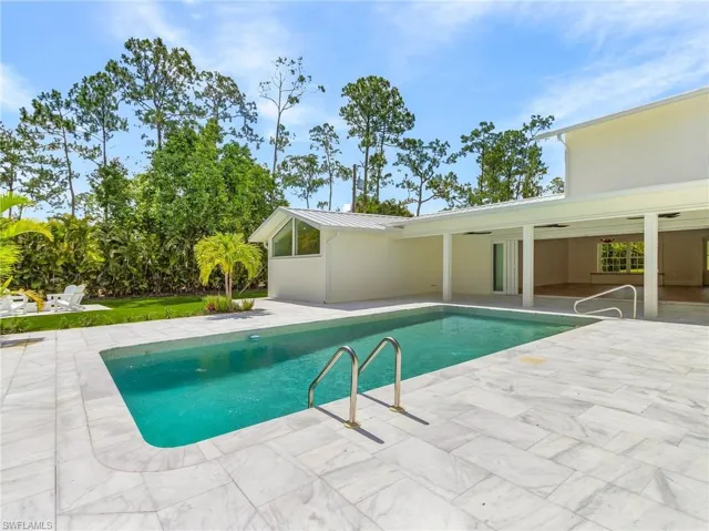 Swimming pool with a patio