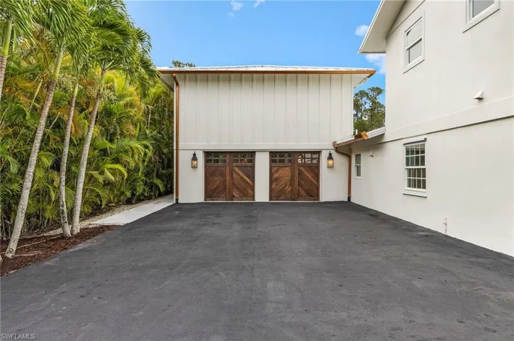 Garage featuring driveway