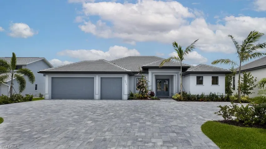 View of front of property featuring a garage