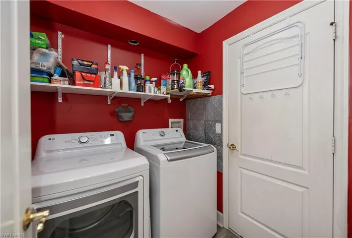 Clothes washing area featuring washer and clothes dryer