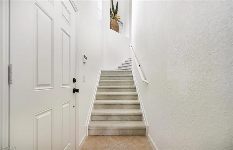 Stairway with tile patterned floors