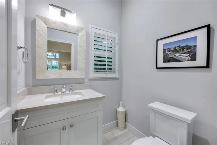 Powder room is just off the living room.