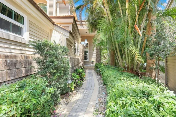 Walkway leads to private entryway.