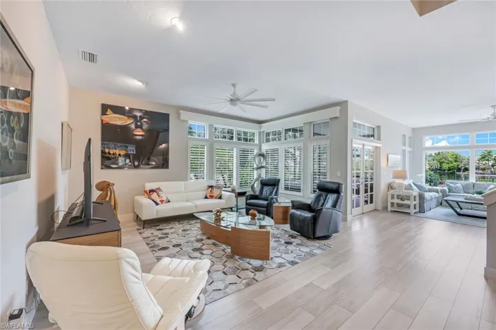 Access to pool/lanai from the great room. Notice how LIGHT and BRIGHT this home is!