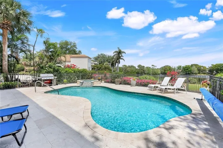 Swim day or night, this home offers so much outdoor space to entertain and stunning lake views!