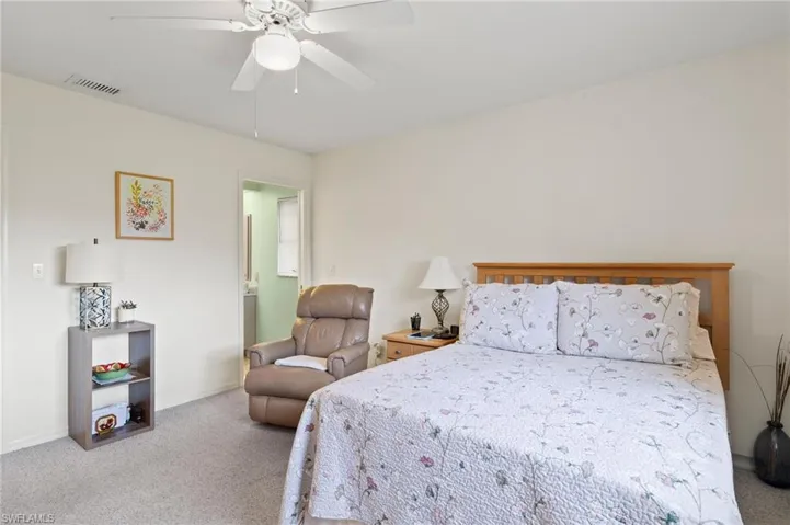 Master Bedroom with carpet flooring and ceiling fan